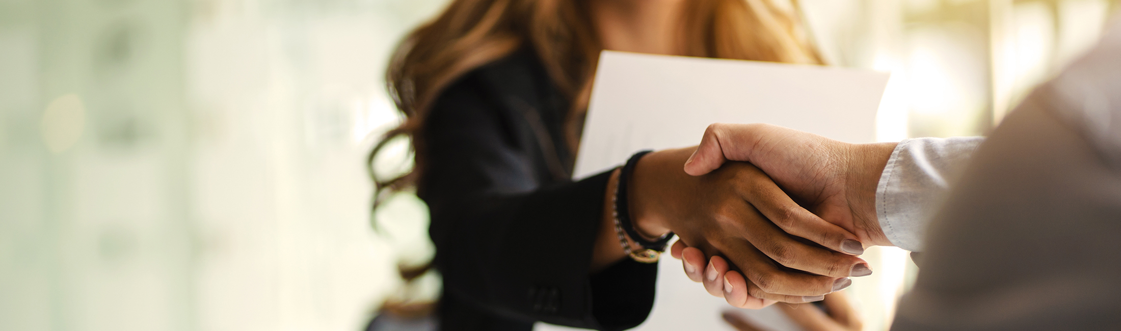 image of woman and man shaking hands